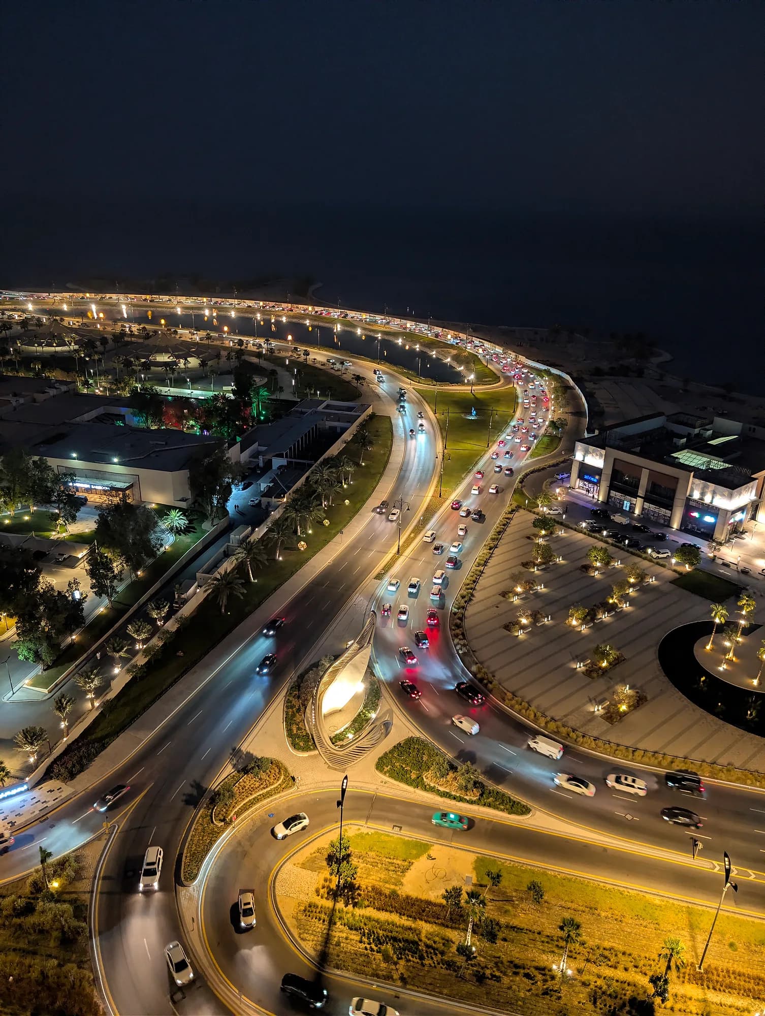 Aerial night view of the Al Khobar corniche and lake, Saudi Arabia