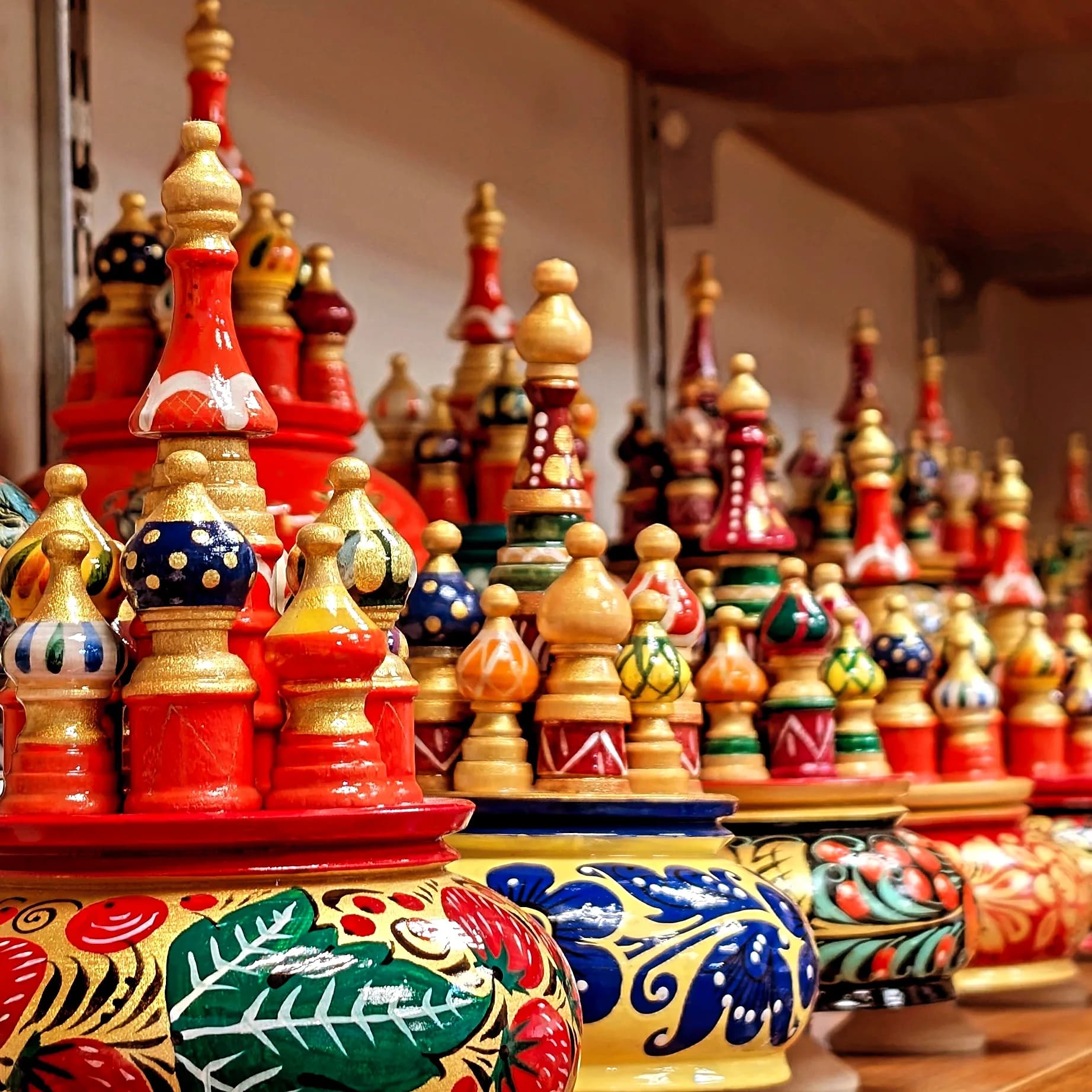 Rows of colourful hand-painted wooden souvenirs